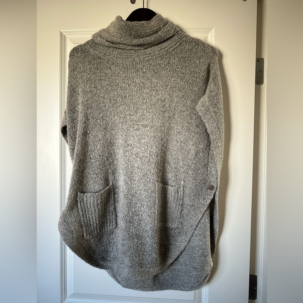 Gray pullover sweater very open, need to wear a t-shirt underneath.